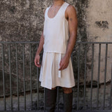 The Glade model wears a men's skirt and singlet